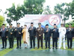 Pj Bupati Busel Hadiri HUT Bhayangkara Ke-78